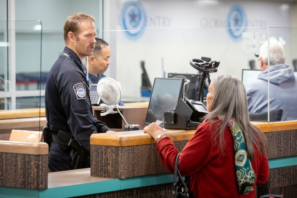 CBP officers process arriving international travelers at Phoenix Sky Harbor International Airport.